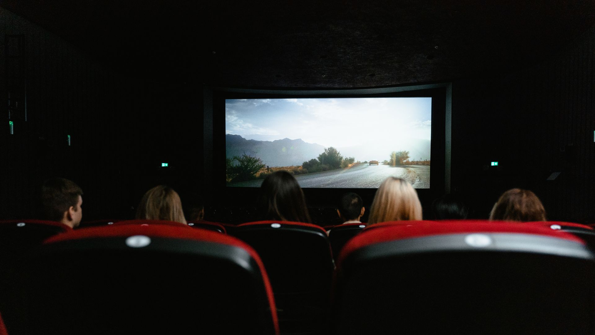 Cinema screen and audience watching a movie.