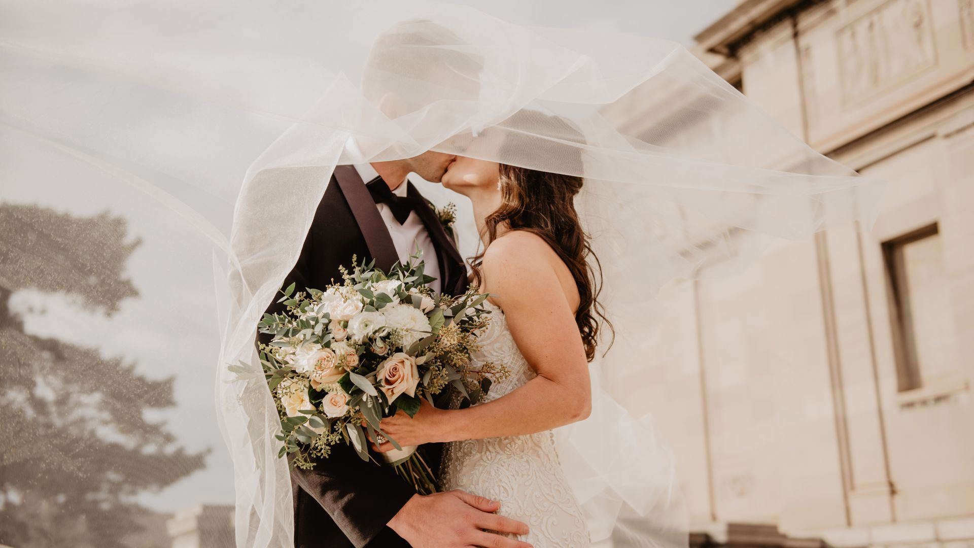 Couple in wedding outfits getting married.